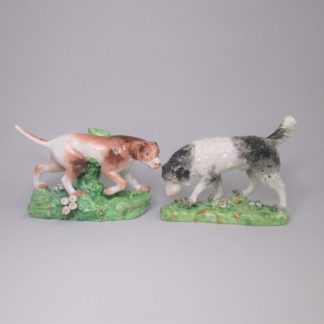 A Good pair of porcelain Derby pointer and companion dogs, probably modelled by William Coffee. Circa 1795