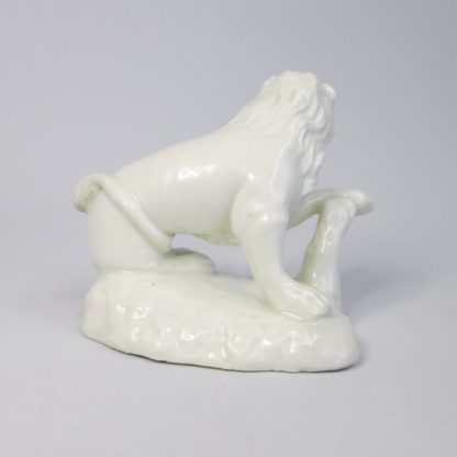 A rare Bow early "Blanc De Chine" seated Lion, left facing on an irregular rock work oblong base with it's left paw resting on a stump. Circa 1750-2 - Image 5