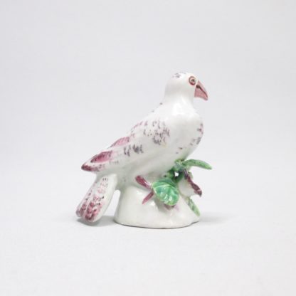 A rare porcelain miniature Bow dove perched on a small mound with leaves and a flower and hand decorated in puce colours Circa 1758-60. - Image 5