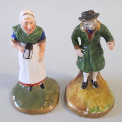 A pair of miniature Staffordshire figures of an old man and woman. Circa 1880. - Image 2