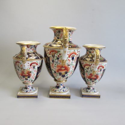 A large garniture of Bloor Derby Vases, decorated with Imari colours of iron red, blue and gold, with acanthus scroll handles and square base.  Circa 1830-35 - Image 3