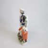 A Staffordshire figure of two children the boy "trundling" with a hoop and stick and the girl with a rabbit. Circa 1860 - Image 4