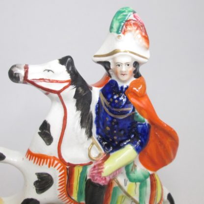 A Victorian Staffordshire military equestrian figure of a soldier with a sword and a canon and canon balls at his feet. Circa 1860. - Image 5