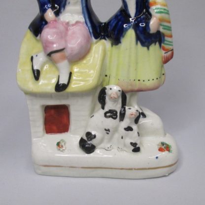 A Staffordshire pottery figure of young boy and girl with a dog and a puppy. Circa 1860 - Image 3