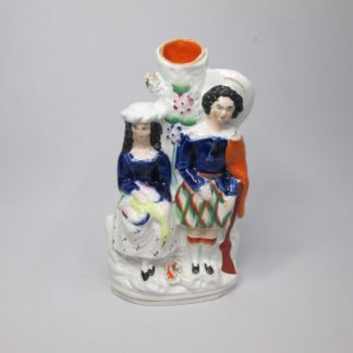 A Staffordshire spill holder group figure of a hunter and companion Circa 1860