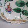 An eighteenth century Worcester porcelain Blind Earl dish, with raised moulding rose buds and leaves and a scalloped edge rim finished with a continuous gilt line. Circa: 1770. - Image 7
