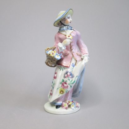 A Bow Porcelain Figure of a Lady Standing with a basket of flowers over her right arm and is representing the season of spring.  Circa 1760 - Image 2