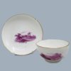 A Pinxton porcelain tea bowl and saucer, decorated in  puce with rural landscapes, attributed to William Billingsley. Circa 1796 to 1813
