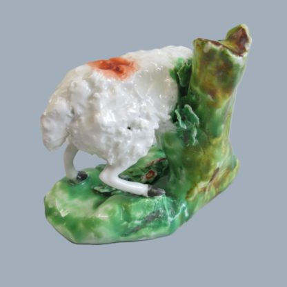 A Derby model of a ram standing on a grassy mound eating foliage.  Circa 1790 - Image 7