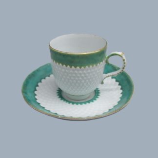 A Bow Porcelain Coffee cup and saucer with pinecone moulding and rare  anchor and dagger mark hand painted in red.   Circa: 1765-70