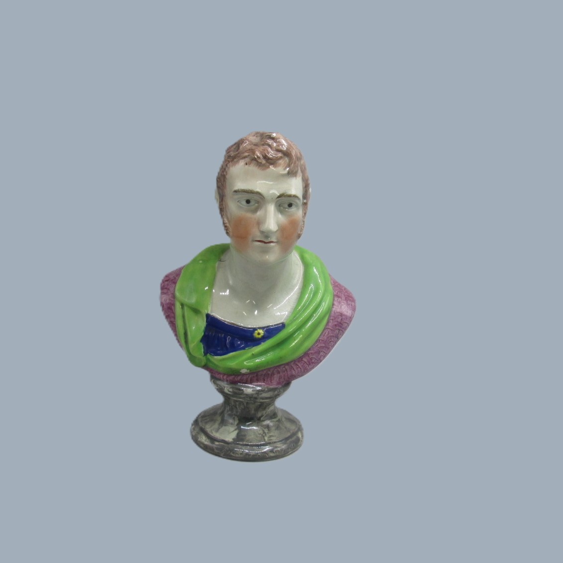 A Staffordshire pottery bust of Sir Isaac Newton mounted on a grey marbleised soccle base. Circa 19th century