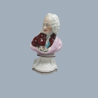 A Staffordshire pearl ware bust of Francois-Marie Arouet 'Voltaire'. Impressed Voltaire to base. Circa; Late 18th/early 19th century