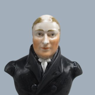 A Staffordshire pottery bust of William Clowes, Primitive Methodist preacher, mounted on a red marbleised socco base. Circa; 19th Century