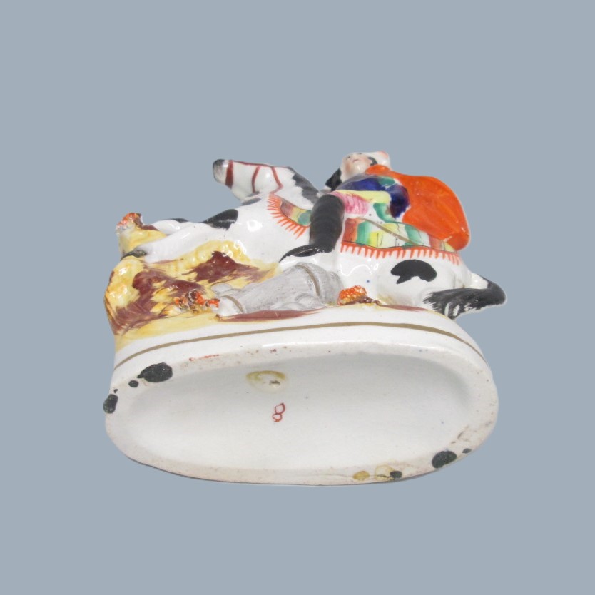 A Victorian Staffordshire military equestrian figure of a soldier with a sword and a canon and canon balls at his feet. Circa 1860. - Image 12