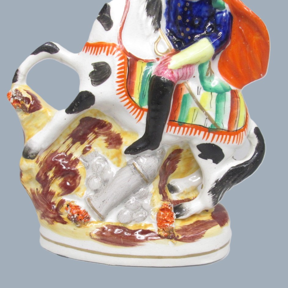 A Victorian Staffordshire military equestrian figure of a soldier with a sword and a canon and canon balls at his feet. Circa 1860. - Image 11