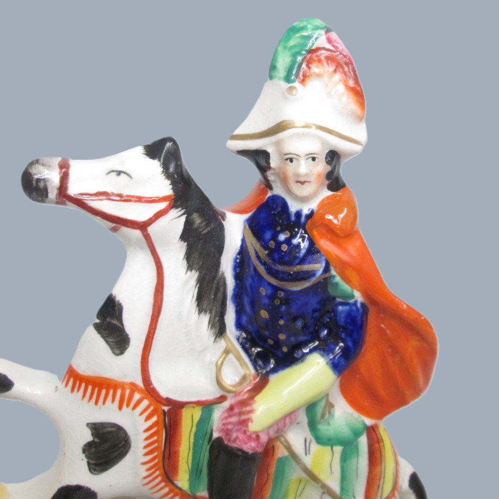 A Victorian Staffordshire military equestrian figure of a soldier with a sword and a canon and canon balls at his feet. Circa 1860. - Image 10