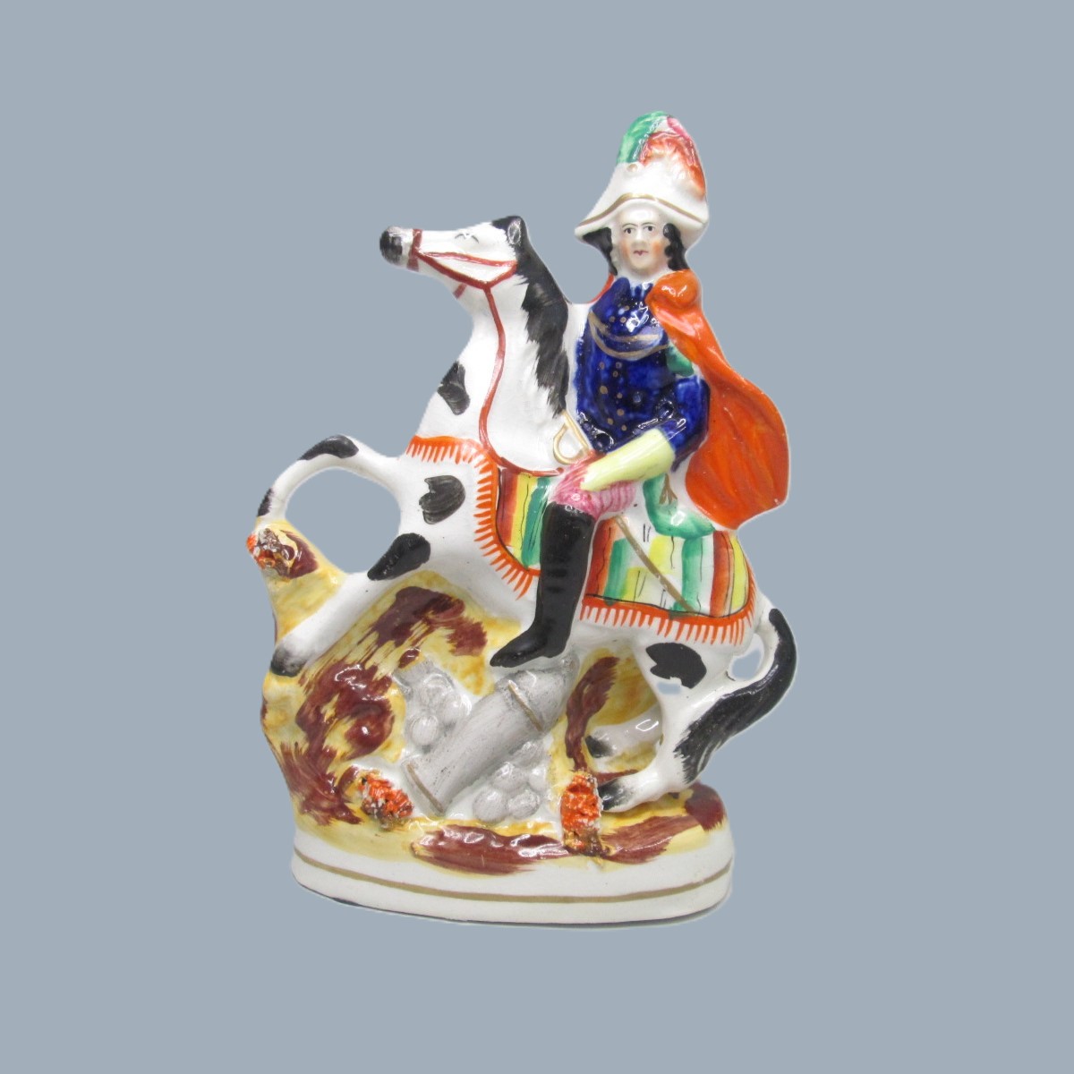 A Victorian Staffordshire military equestrian figure of a soldier with a sword and a canon and canon balls at his feet. Circa 1860. - Image 9