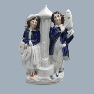 A rare Staffordshire Dudson portrait figure of a boy and a girl at a water fountain.   Circa 1855