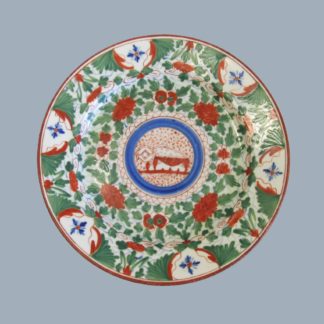 A Minton plate painted with 'Crazy Cow' pattern No 106 hand decorated in green, blue and red. Circa 1805.