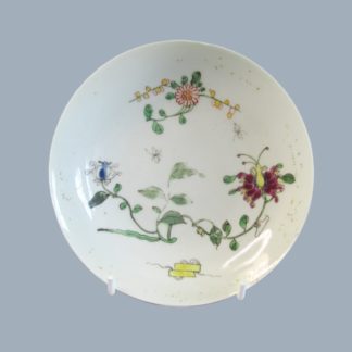 A Worcester first period Dr Wall Polychrome saucer painted in the Chinese style with the Honeysuckle or Hibiscus pattern. Circa; 1760.