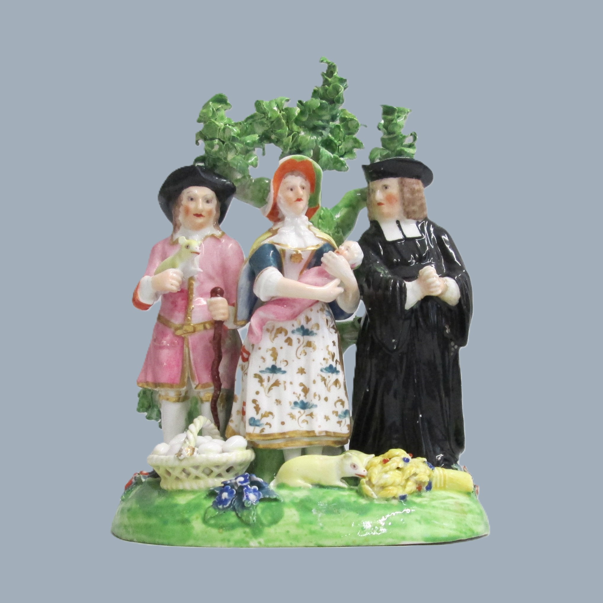 A Derby Tithe Pig Group, representing the Farmer's wife, offering her baby to the Clergyman as payment of the tithe, instead of the pig. Circa 1790