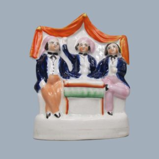 A Staffordshire figure depicting Auld Lang Syne, taken from an illustration of the poem by John Masey Wright and John Rogers. Circa 1855