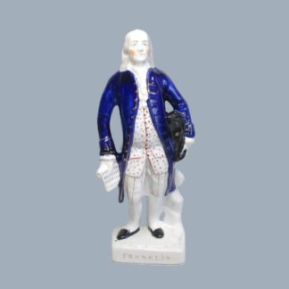 A Staffordshire figure of Benjamin Franklin, moulded lettering bearing his name and highlighted in gold to the base. Circa 1850.