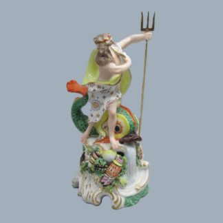 A Derby porcelain figure of Neptune, standing on a rocky mound a with trident in his left hand and a large dolphin beside him. Circa 1760 -70