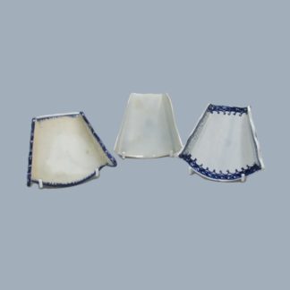 Three Staffordshire pearlware blue and white, fan shaped, asparagus servers, two with pierced sides and one plain. Circa 1790-1800.