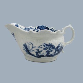 A First Period Worcester porcelain small sauce boat relief moulded body hand decorated in blue with the two porters Landscape pattern. Circa; 1770.