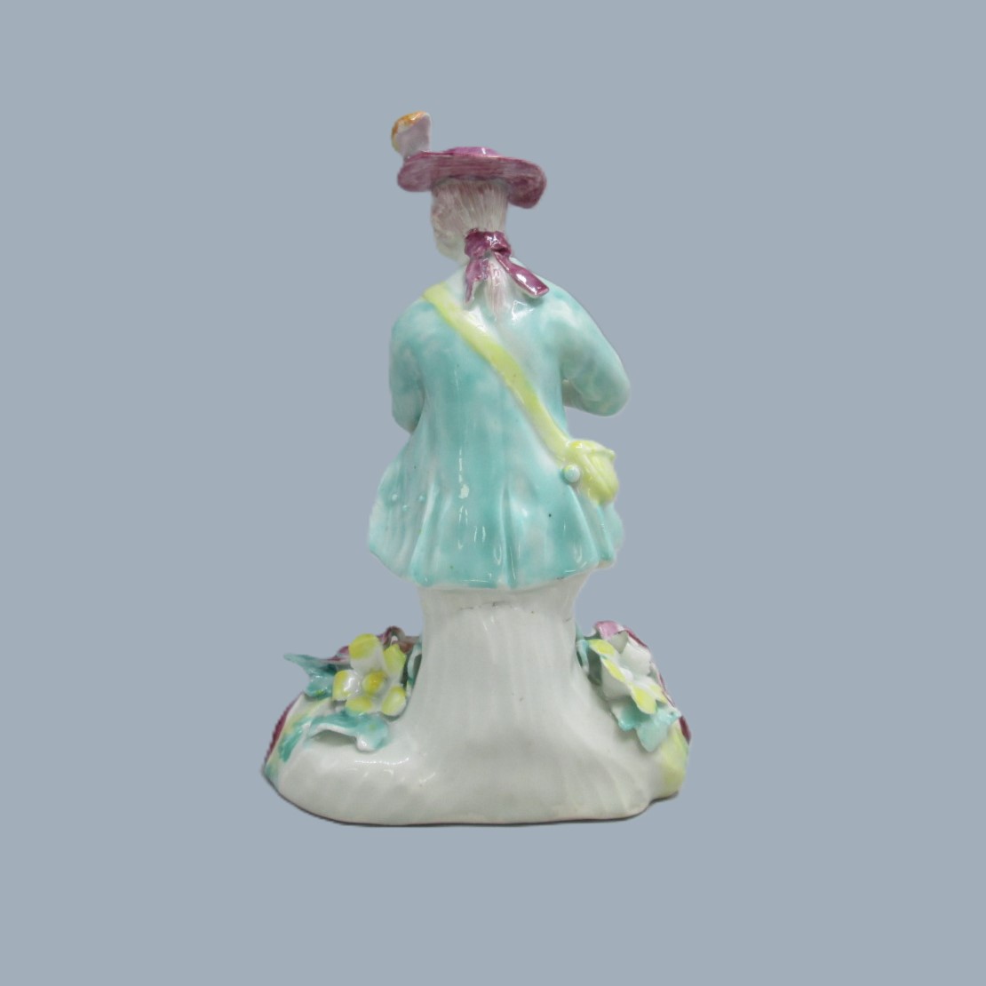 A Derby seated musician playing a flute hand decorated with a turquoise jacket and floral waistcoat and trousers. Circa 1756 - Image 6