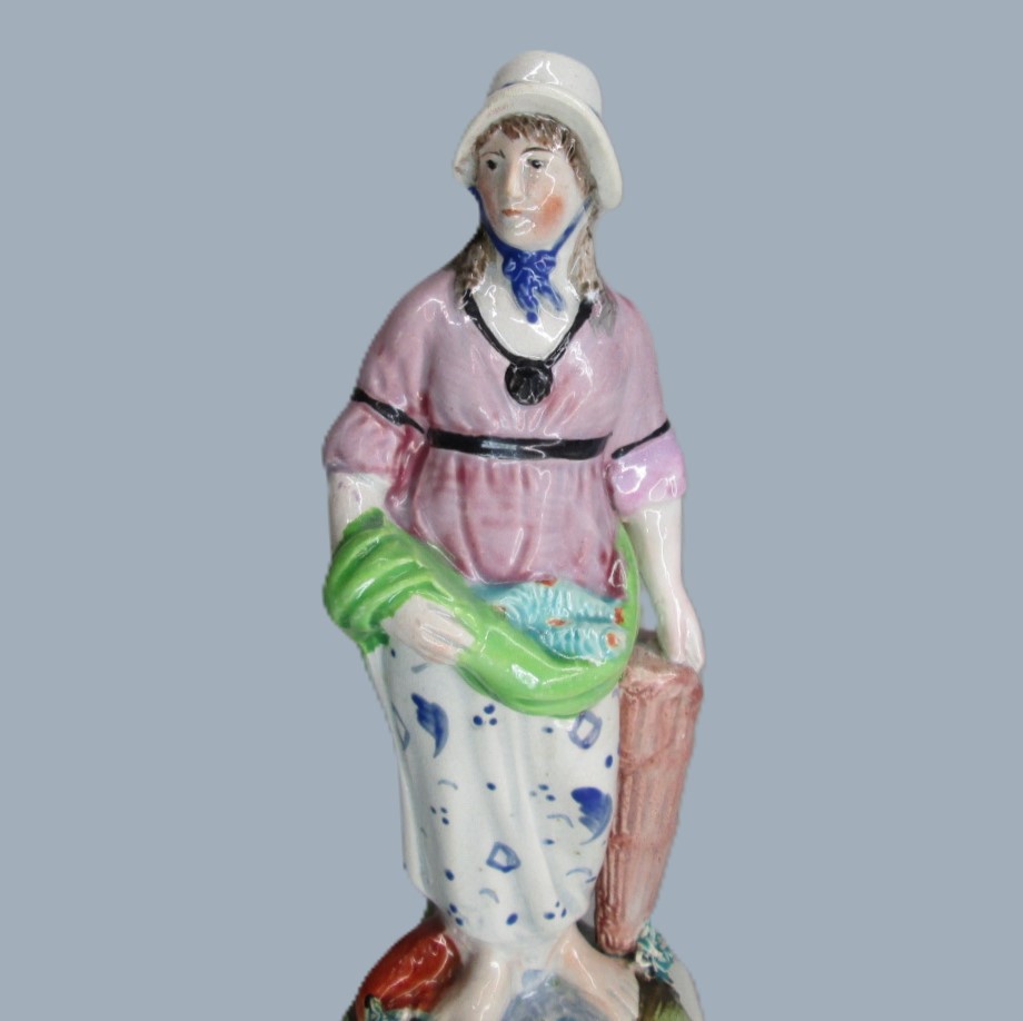 A Staffordshire pearlware square based pottery figure of a Lady holding fish in her apron, emblematic of the element 'Water'. Circa; 1800 - Image 2