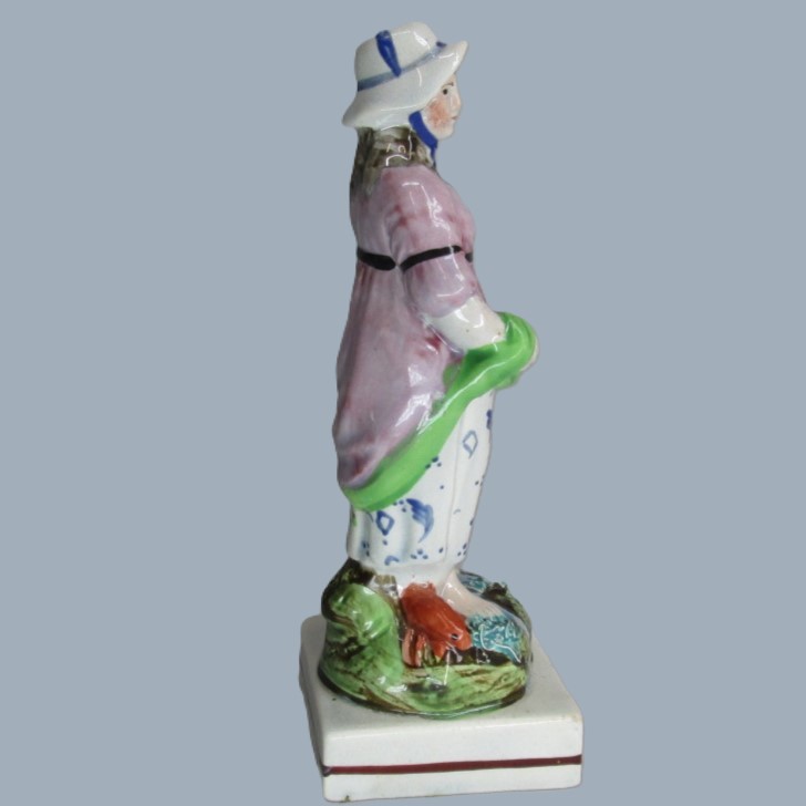 A Staffordshire pearlware square based pottery figure of a Lady holding fish in her apron, emblematic of the element 'Water'. Circa; 1800 - Image 12