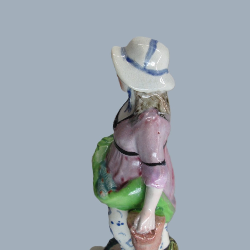 A Staffordshire pearlware square based pottery figure of a Lady holding fish in her apron, emblematic of the element 'Water'. Circa; 1800 - Image 5