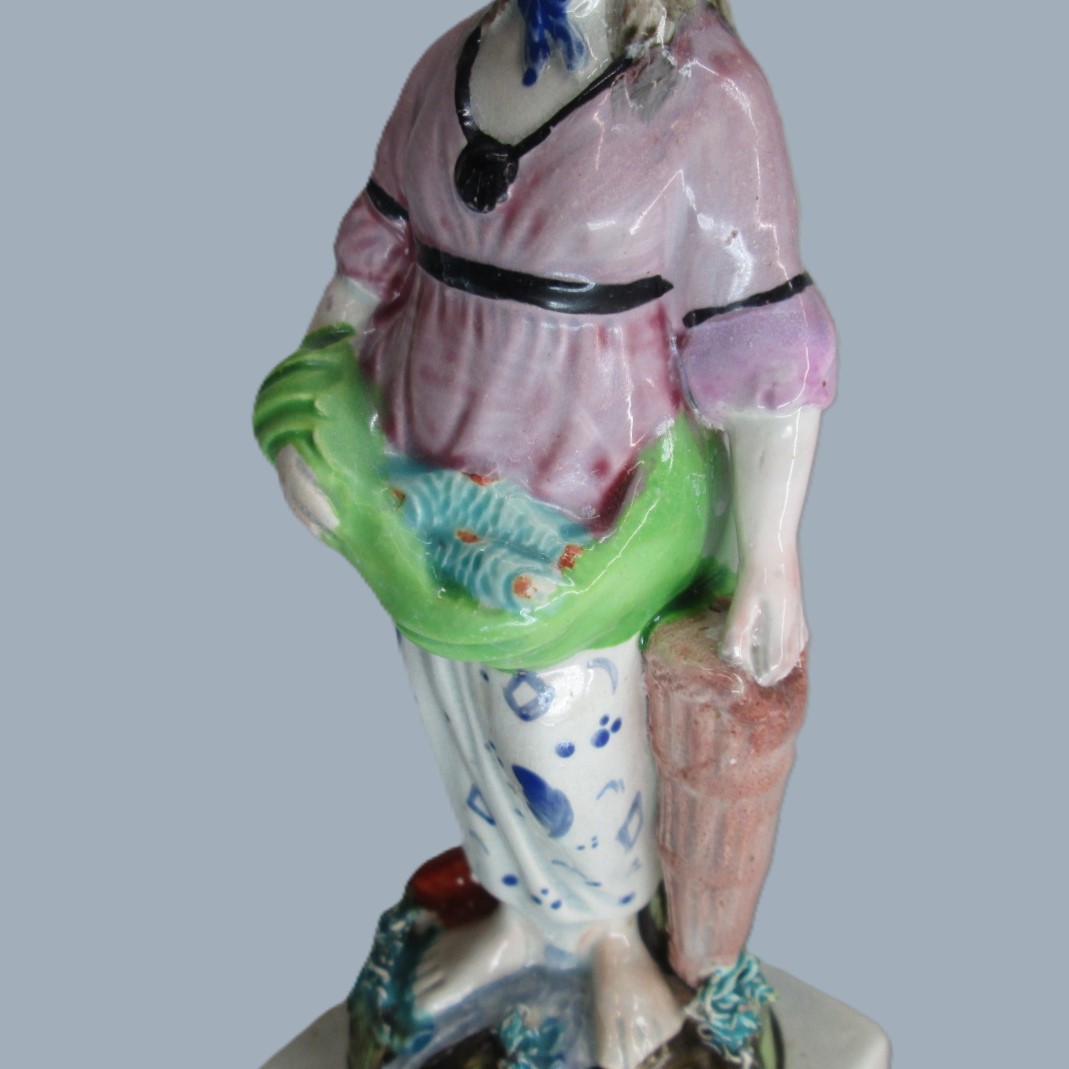 A Staffordshire pearlware square based pottery figure of a Lady holding fish in her apron, emblematic of the element 'Water'. Circa; 1800 - Image 6