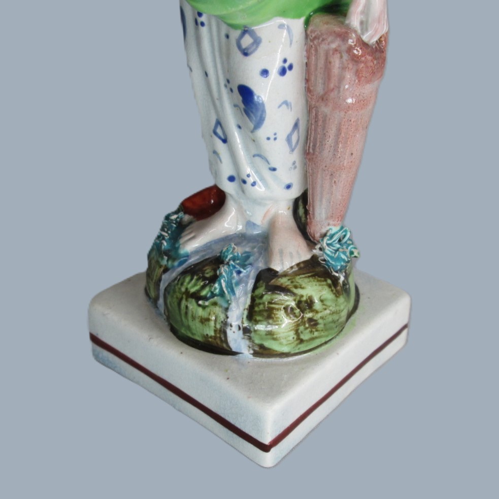 A Staffordshire pearlware square based pottery figure of a Lady holding fish in her apron, emblematic of the element 'Water'. Circa; 1800 - Image 7