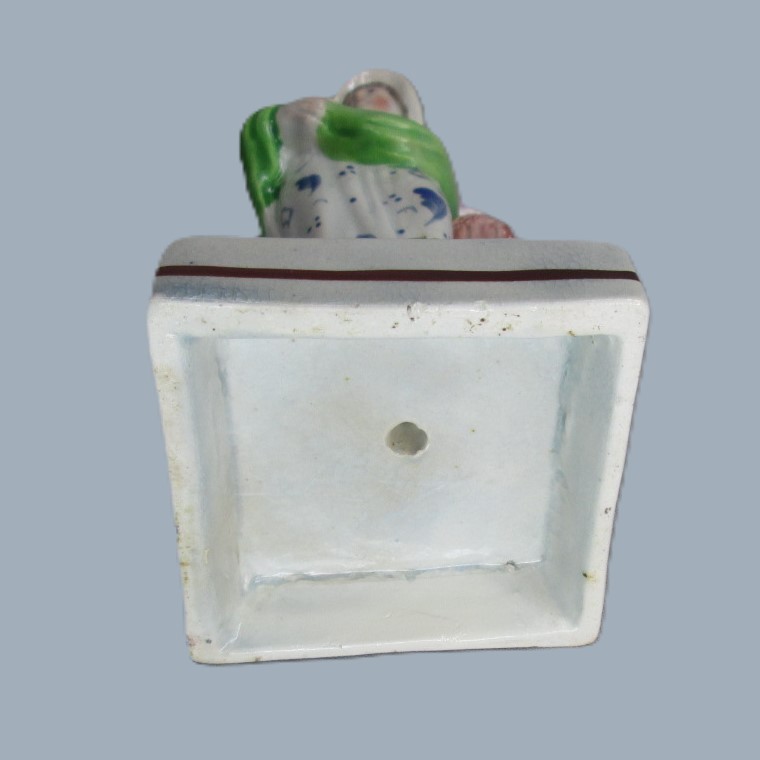 A Staffordshire pearlware square based pottery figure of a Lady holding fish in her apron, emblematic of the element 'Water'. Circa; 1800 - Image 8