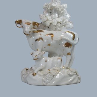 A Derby group of a cow with her recumbent calf, glazed white ground heightened with gilding  Circa 1810-20